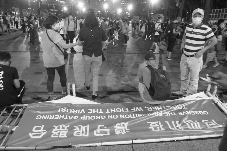 People gathered to remember the Tiananmen massacre, despite an official police ban using Covid-19 social gathering restrictions on this year’s candlelight vigil, Victoria Park, Causeway Bay, Hong Kong, 4 June 2020 (photograph: John Batten) 