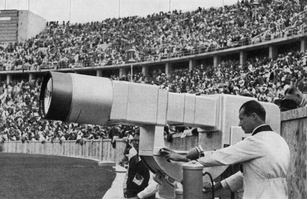 A German technician checks the Television canon put in the Olympic Stadium, 01 August 1936, a huge electronic camera buildt by Telefunken, which broadcast live for the first time, 8 hours each day, the Berlin Olympics Games show. (Photo by HO / AFP)