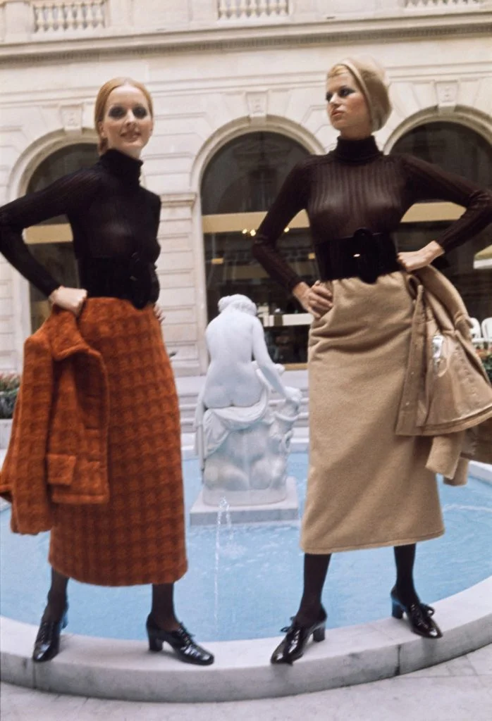 Models presents creations consisting of a tweed suit worn over a midi skirt by Torrente for the Fall/Winter 1970-1971 collection in Paris on July 21, 1970. (Photo by AFP)