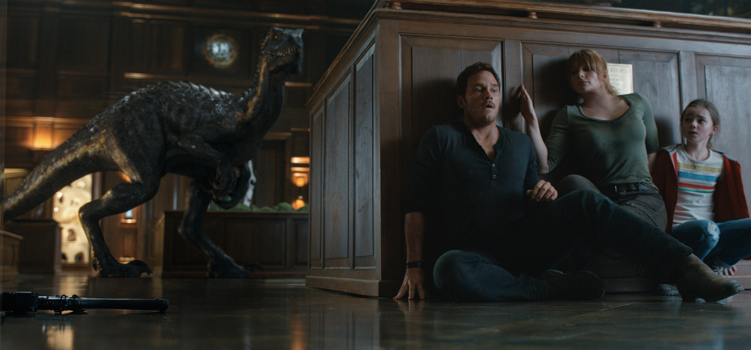 The Indoraptor stalks its prey—(L to R) Owen (CHRIS PRATT), Claire (BRYCE DALLAS HOWARD) and Maisie (ISABELLA SERMON) in "Jurassic World: Fallen Kingdom." When the island's dormant volcano begins roaring to life, Owen and Claire (Bryce Dallas Howard) mount a campaign to rescue the remaining dinosaurs from this extinction-level event. Welcome to "Jurassic World: Fallen Kingdom."